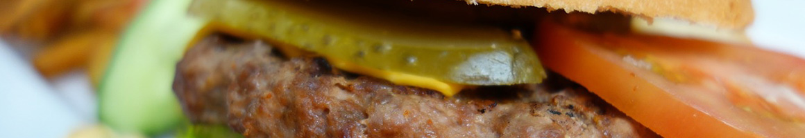 Eating Barbeque Burger at Fenoglios BBQ restaurant in Nocona, TX.